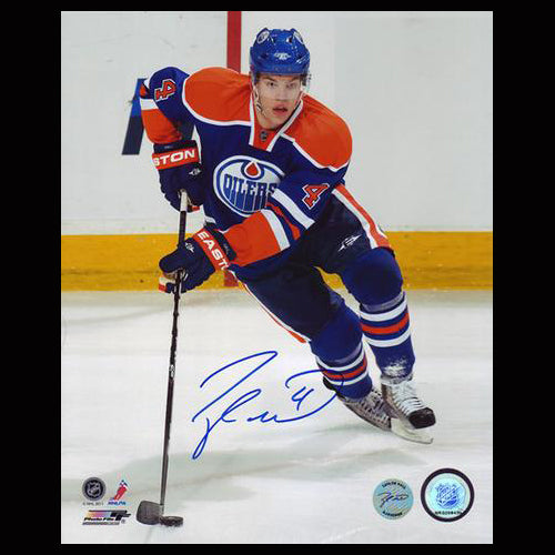 Taylor Hall Autographed Edmonton Oilers Puck Action 8x10 Photo - Clearance